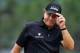 PINEHURST, NC - JUNE 12: Phil Mickelson of the United States tips his cap during the first round of the 114th U.S. Open at Pinehurst Resort & Country Club, Course No. 2 on June 12, 2014 in Pinehurst, North Carolina. (Photo by David Cannon/Getty Images)