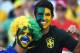 SAO PAULO, BRAZIL - JUNE 12: Brazil fans with painted faces smile before the 2014 FIFA World Cup Brazil Group A match between Brazil and Croatia at Arena de Sao Paulo on June 12, 2014 in Sao Paulo, Brazil. (Photo by Buda Mendes/Getty Images)