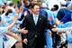 CHAPEL HILL, NC - OCTOBER 27: Coach Larry Fedora of the North Carolina Tar Heels greets fans during the Old Well Walk before a game against the North Carolina State Wolfpack during play at Kenan Stadium on October 27, 2012 in Chapel Hill, North Carolina.