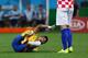 SAO PAULO, BRAZIL - JUNE 12: Neymar of Brazil lies on the field after a challenge in the second half during the 2014 FIFA World Cup Brazil Group A match between Brazil and Croatia at Arena de Sao Paulo on June 12, 2014 in Sao Paulo, Brazil. (Photo by Kev