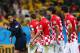 SAO PAULO, BRAZIL - JUNE 12: Referee Yuichi Nishimura is pursued by Darijo Srna, Sime Vrsaljko, Vedran Corluka and Dejan Lovren of Croatia after awarding a penalty kick and giving Lovren a yellow card in the second half during the 2014 FIFA World Cup Braz