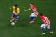 SAO PAULO, BRAZIL - JUNE 12: Neymar of Brazil controls the ball as Luka Modric and Mateo Kovacic (R) of Croatia and during the 2014 FIFA World Cup Brazil Group A match between Brazil and Croatia at Arena de Sao Paulo on June 12, 2014 in Sao Paulo, Brazi