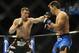 Feb 22, 2014; Las Vegas, NV, USA; Rory MacDonald (red gloves) throws a punch at Demian Maia (blue gloves) during their UFC welterweight bout at Mandalay Bay. MacDonald won by way of a 29-28 decision. Mandatory Credit: Stephen R. Sylvanie-USA TODAY Sports