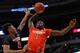 CHICAGO, IL - APRIL 2: Theo Pinson #1 of the East team goes up for a dunk against Kelly Oubre Jr. #12 of the West team during the 2014 McDonald's All American Game at United Center on April 2, 2014 in Chicago, Illinois. The West defeated the East 105-102.