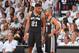 MIAMI, FL - JUNE 12: Tim Duncan #21 and Tony Parker #9 of the San Antonio Spurs share a moment on the sidelines against the Miami Heat during Game Six of the 2014 NBA Finals on June 12, 2014 at American Airlines Arena in Miami, Florida. NOTE TO USER: User