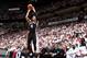 MIAMI, FL - JUNE 12: Miami Heat players watch as Danny Green #4 of the San Antonio Spurs shoots a three pointer during Game Four of the 2014 NBA Finals at American Airlines Arena in Miami, Florida on June 12, 2014. NOTE TO USER: User expressly acknowledg