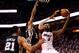 MIAMI, FL - JUNE 12: LeBron James #6 of the Miami Heat goes to the basket against Kawhi Leonard #2 and Tim Duncan #21 of the San Antonio Spurs during Game Four of the 2014 NBA Finals at American Airlines Arena on June 12, 2014 in Miami, Florida. NOTE TO