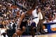 23 Apr 1998: Tim Duncan #21 of the San Antonio Spurs dribbles the ball around a player from the Phoenix Suns during a first round playoff game at the America West Arena in Phoenix, Arizona. The Spurs defeated the Suns 102-96. Mandatory Credit: Tom Hauck
