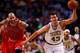 BOSTON, MA - MARCH 30: Kris Humphries #43 of the Boston Celtics grabs a loose ball in front of Carlos Boozer #5 of the Chicago Bulls in the first period during the game at TD Garden on March 30, 2014 in Boston, Massachusetts. NOTE TO USER: User expressly