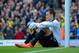 NORWICH, ENGLAND - APRIL 20: A dejected Simon Mignolet of Liverpool sits on the pitch after conceding a second goal during the Barclays Premier League match between Norwich City and Liverpool at Carrow Road on April 20, 2014 in Norwich, England. (Photo b