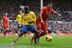 LIVERPOOL, ENGLAND - FEBRUARY 08: Luis Suarez of Liverpool is challenged by Bacary Sagna of Arsenal during the Barclays Premier League match between Liverpool and Arsenal at Anfield on February 8, 2014 in Liverpool, England. (Photo by Michael Regan/Gett