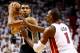 MIAMI, FL - JUNE 12: Tim Duncan #21 of the San Antonio Spurs looks to pass as Chris Bosh #1 of the Miami Heat defends during Game Four of the 2014 NBA Finals at American Airlines Arena on June 12, 2014 in Miami, Florida. NOTE TO USER: User expressly ackno