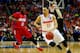 BUFFALO, NY - MARCH 22: Tyler Ennis #11 of the Syracuse Orange drives to the basket as Khari Price #0 of the Dayton Flyers defends during the third round of the 2014 NCAA Men's Basketball Tournament at the First Niagara Center on March 22, 2014 in Buffalo