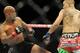 Jul 27, 2013; Seattle, WA, USA; Demetrious Johnson (red tape) kicks John Moraga (blue tape) during their welterweight bout at Key Arena. Johnson won by a tap out. Mandatory Credit: Jayne Kamin-Oncea-USA TODAY Sports