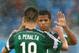 NATAL, BRAZIL - JUNE 13: Oribe Peralta of Mexico (L) celebrates his goal with Giovani dos Santos during the 2014 FIFA World Cup Brazil Group A match between Mexico and Cameroon at Estadio das Dunas on June 13, 2014 in Natal, Brazil. (Photo by Jamie Squ