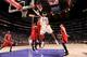 LOS ANGELES, CA - MARCH 3: Kobe Bryant #24 of the Los Angeles Lakers shoots a layup against Josh Smith #5 of the Atlanta Hawks at Staples Center on March 3, 2013 in Los Angeles, California. NOTE TO USER: User expressly acknowledges and agrees that, by dow