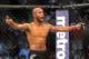 Jul 27, 2013; Seattle, WA, USA; Demetrious Johnson celebrates his welterweight fight win over John Moraga (not pictured) at Key Arena. Johnson won by a Tap Out. Mandatory Credit: Jayne Kamin-Oncea-USA TODAY Sports