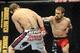 Nov 16, 2013; Las Vegas, NV, USA; Tim Elliott (red gloves) fights against Ali Bagautinov (blue gloves) in their flyweight bout during UFC 167 at MGM Grand Garden Arena. Mandatory Credit: Stephen R. Sylvanie-USA TODAY Sports