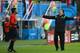 NATAL, BRAZIL - JUNE 13: Head coach Miguel Herrera of Mexico reacts toward fourth official Norbert Hauata during the 2014 FIFA World Cup Brazil Group A match between Mexico and Cameroon at Estadio das Dunas on June 13, 2014 in Natal, Brazil. (Photo by Ma
