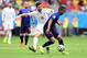 SALVADOR, BRAZIL - JUNE 13: Jonathan de Guzman of the Netherlands fights off a challenge by Xabi Alonso of Spain in the first half during the 2014 FIFA World Cup Brazil Group B match between Spain and Netherlands at Arena Fonte Nova on June 13, 2014 in S