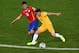 CUIABA, BRAZIL - JUNE 13: Charles Aranguiz of Chile challenges Tommy Oar of Australia during the 2014 FIFA World Cup Brazil Group B match between Chile and Australia at Arena Pantanal on June 13, 2014 in Cuiaba, Brazil. (Photo by Stu Forster/Getty Images