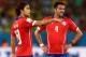 CUIABA, BRAZIL - JUNE 13: Jorge Valdivia (L) and Mauricio Isla of Chile discuss a free kick during the 2014 FIFA World Cup Brazil Group B match between Chile and Australia at Arena Pantanal on June 13, 2014 in Cuiaba, Brazil. (Photo by Cameron Spencer/Ge
