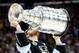 LOS ANGELES, CA - JUNE 13: Dustin Brown #23 of the Los Angeles Kings celebrates with the Stanley Cup after the Kings 3-2 double overtime victory against the New York Rangers in Game Five of the 2014 Stanley Cup Final at Staples Center on June 13, 2014 in