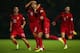 BELFAST, NORTHERN IRELAND - SEPTEMBER 06: Cristiano Ronaldo of Portugal celebrates scoring with team mate Joao Periera during the FIFA 2014 World Cup Qualifying Group F match between Northern Ireland and Portugal at Windsor Park on September 6, 2013 in B