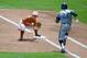 Jun 14, 2014; Omaha, NE, USA; UC Irvine Anteaters infielder Chris Rabago (22) is out at first against Texas Longhorns infielder Kacy Clemens (42) during game one of the 2014 College World Series at TD Ameritrade Park Omaha. Mandatory Credit: Steven Bransc
