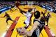 MIAMI, FL - JUNE 12: Dwyane Wade #3 of the Miami Heat goes to the basket against Manu Ginobili #20 of the San Antonio Spurs during Game Four of the 2014 NBA Finals at American Airlines Arena on June 12, 2014 in Miami, Florida. NOTE TO USER: User expressly