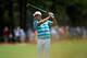 PINEHURST, NC - JUNE 14: Rickie Fowler of the United States hits an approach shot on the second hole during the third round of the 114th U.S. Open at Pinehurst Resort & Country Club, Course No. 2 on June 14, 2014 in Pinehurst, North Carolina. (Photo by