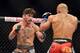 Aug 3, 2013; Rio De Janeiro, Brazil; Ian McCall (red gloves) and Iliarde Santos fight during UFC 163 at HSBC Arena. Mandatory Credit: Jason Silva-USA TODAY Sports