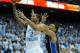 CHAPEL HILL, NC - FEBRUARY 20: Jabari Parker #1 of the Duke Blue Devils defends a shot by Leslie McDonald #2 of the North Carolina Tar Heels during their game at the Dean Smith Center on February 20, 2014 in Chapel Hill, North Carolina. North Carolina wo