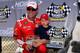 BROOKLYN, MI - JUNE 13: Kevin Harvick, driver of the #4 Budweiser Chevrolet, poses with son Keelan and the BanditChippers.com Pole Award after qualifying for the pole for the NASCAR Sprint Cup Series Quicken Loans 400 at Michigan International Speedway o
