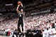 MIAMI, FL - JUNE 12: Miami Heat players watch as Danny Green #4 of the San Antonio Spurs shoots a three pointer during Game Four of the 2014 NBA Finals at American Airlines Arena in Miami, Florida on June 12, 2014. NOTE TO USER: User expressly acknowledg