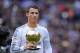 MADRID, SPAIN - JANUARY 25: Cristiano Ronaldo of Real Madrid CF holds the Ballon d'Or 2013 award prior to he start of the La Liga match between Real Madrid CF and Granada CF at Santiago Bernabeu stadium on January 25, 2014 in Madrid, Spain. (Photo by De