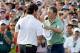 AUGUSTA, GA - APRIL 13: Bubba Watson of the United States shakes hands with Jordan Spieth on the 18th green after Watson won the 2014 Masters Tournament by a three-stroke margin at Augusta National Golf Club on April 13, 2014 in Augusta, Georgia. (Photo