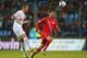 LUXEMBOURG - OCTOBER 11: Yury Zhirkov of Russia battles for the ball with Chris Philipps of Luxembourg during the FIFA 2014 World Cup Qualifier Group F match between Luxembourg and Russia at the Josy Barthel Stadium on October 11, 2013 in Luxembourg, Lux