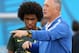 SAO PAULO, BRAZIL - JUNE 11: Manger Luiz Felipe Scolari of Brazil speaks as Willian looks on during a Brazil training session ahead of the 2014 FIFA World Cup Brazil opening match against Croatia at Arena de Sao Paulo on June 11, 2014 in Sao Paulo, Brazil