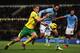 NORWICH, ENGLAND - DECEMBER 29: Michael Turner of Norwich City and Joleon Lescott of Manchester City tussle for the ball during the Barclays Premier League match between Norwich City and Manchester City at Carrow Road on December 29, 2012 in Norwich, Eng
