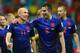 SALVADOR, BRAZIL - JUNE 13: Arjen Robben (L) and Robin van Persie of the Netherlands walk off the field after scoring two goals each and defeating Spain 5-1 during the 2014 FIFA World Cup Brazil Group B match between Spain and Netherlands at Arena Fonte