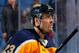 BUFFALO, NY - APRIL 01: Fans cheer Ville Leino #23 of the Buffalo Sabres as he leaves the ice following his game winning shootout goal against the New Jersey Devils on April 1, 2014 at the First Niagara Center in Buffalo, New York. (Photo by Bill Wipper
