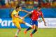 CUIABA, BRAZIL - JUNE 13: Alexis Sanchez of Chile holds off Jason Davidson of Australia during the 2014 FIFA World Cup Brazil Group B match between Chile and Australia at Arena Pantanal on June 13, 2014 in Cuiaba, Brazil. (Photo by Phil Walter/Getty Ima