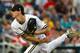 Jun 16, 2014; Omaha, NE, USA; Vanderbilt Commodores pitcher Walker Buehler (13) pitches in relief against the UC Irvine Anteaters during game six of the 2014 College World Series at TD Ameritrade Park Omaha. Vanderbilt defeated UC Irvine 6-4. Mandatory Cr