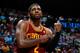 ATLANTA, GA - APRIL 04: Kyrie Irving #2 of the Cleveland Cavaliers grabs his arm after falling out of bounds with the ball against the Atlanta Hawks at Philips Arena on April 4, 2014 in Atlanta, Georgia. NOTE TO USER: User expressly acknowledges and agr