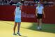 RANCHO MIRAGE, CA - APRIL 06: Lexi Thompson of the USA holes the winning putt as her playing partner Michelle Wie of the USA watches on on the 18th green after her three shot win during the final round of the 2014 Kraft Nabisco Championship on the Dinah