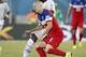 Jun 16, 2014; Natal, Rio Grande do Norte, BRAZIL; United States midfielder Michael Bradley (4) collides with Ghana midfielder Sulley Muntari (11) during the first half of their 2014 World Cup game at Estadio das Dunas. Mandatory Credit: Winslow Townson-US