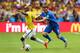 BELO HORIZONTE, BRAZIL - JUNE 14: Victor Ibarbo of Colombia is challenged by Vasilis Torosidis of Greece during the 2014 FIFA World Cup Brazil Group C match between Colombia and Greece at Estadio Mineirao on June 14, 2014 in Belo Horizonte, Brazil. (Phot