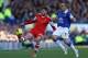 LIVERPOOL, ENGLAND - DECEMBER 29: Adam Lallana of Southampton competes with Leon Osman of Everton during the Barclays Premier League match between Everton and Southampton at Goodison Park on December 29, 2013 in Liverpool, England. (Photo by Clive Bruns