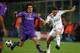 FLORENCE, ITALY - SEPTEMBER 29: Fabio Aurelio of Liverpool shoots past Stevan Jovetic of Fiorentina during the UEFA Champions League Group E match between Fiorentina and Liverpool at the Stadio Artemio Franchi stadium on September 29, 2009 in Florence, I